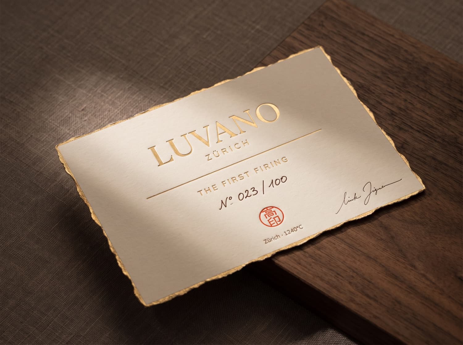 The Luvano firing card — gold-foiled and hand-numbered N° 023 of 100, that accompanies each piece